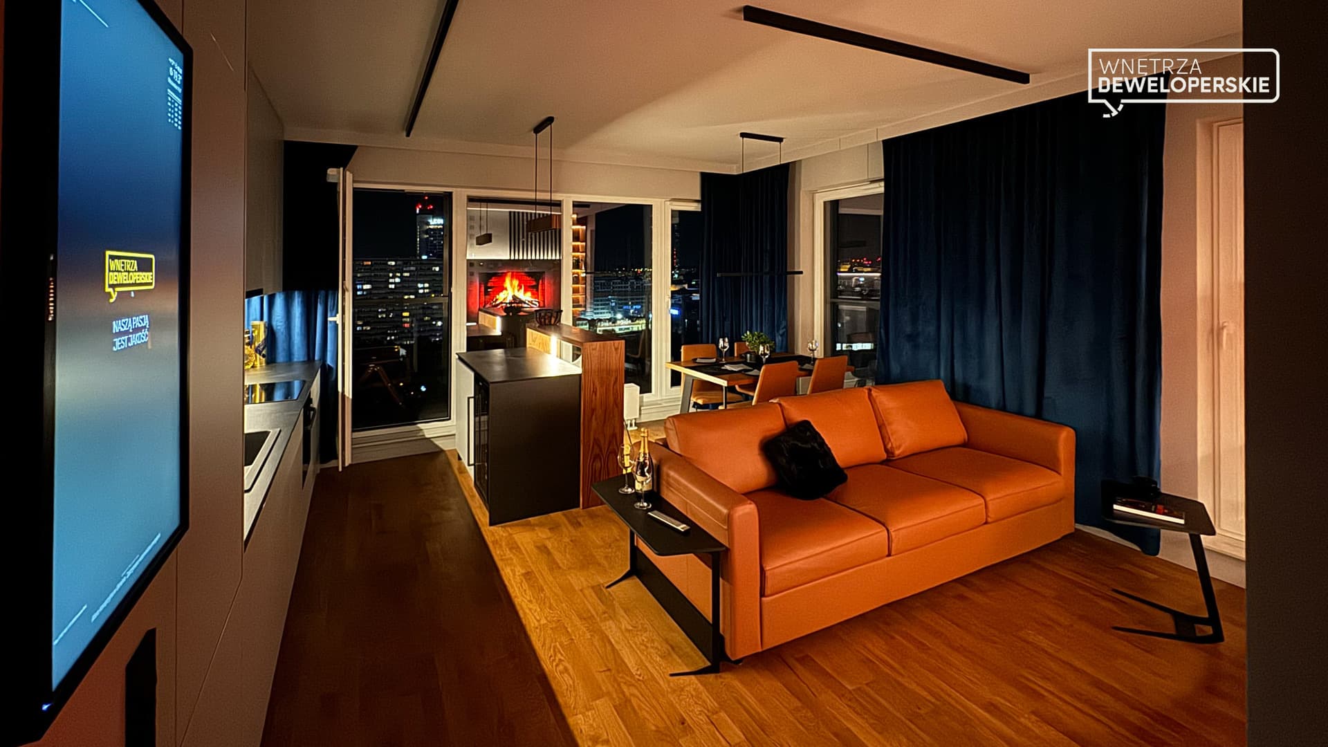 Living room with kitchen at night